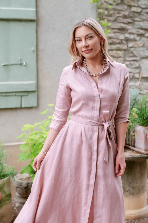 Close-up of Anna Bey in her signature dusty pink linen dress