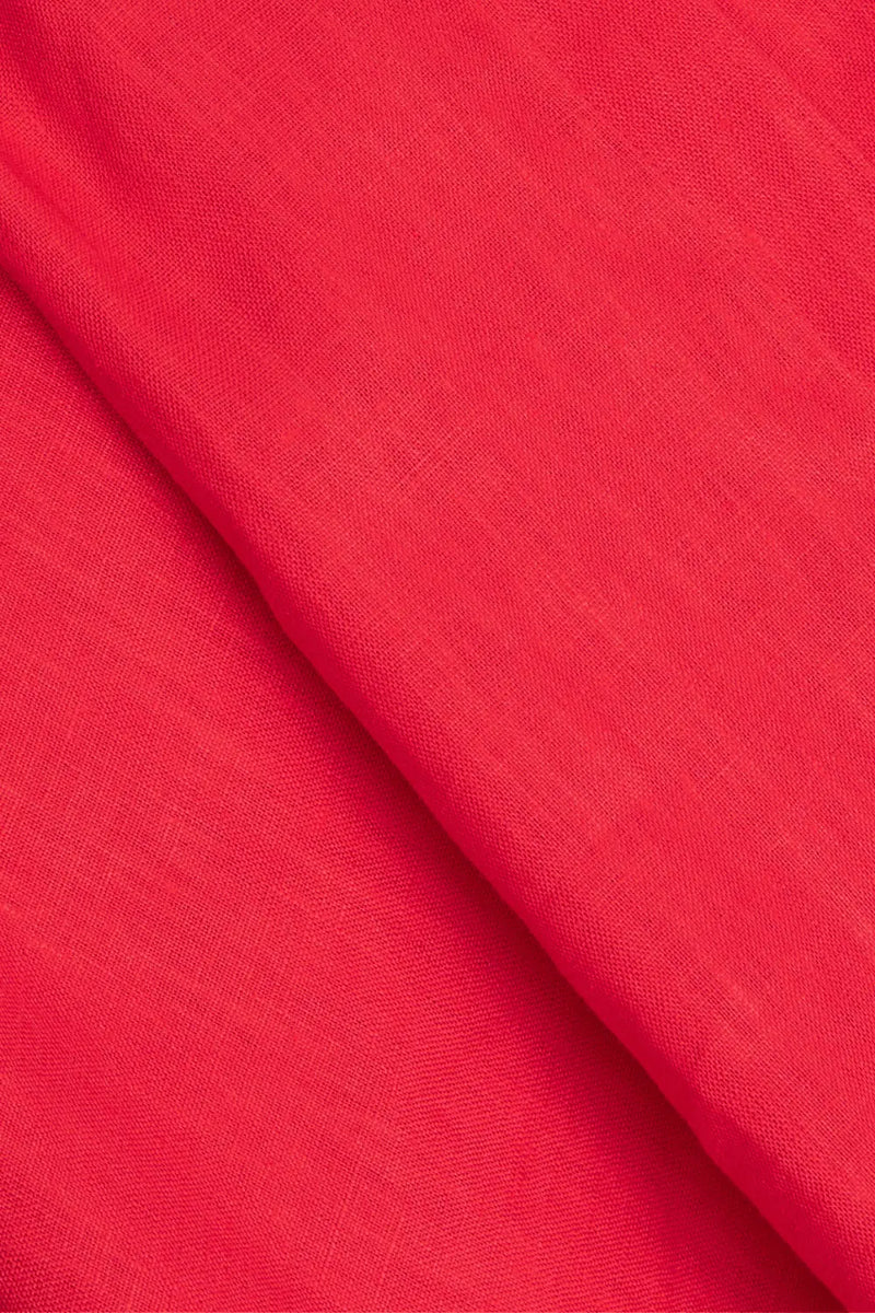 Fabric close-up of Anna Bey's signature linen shirt dress in red