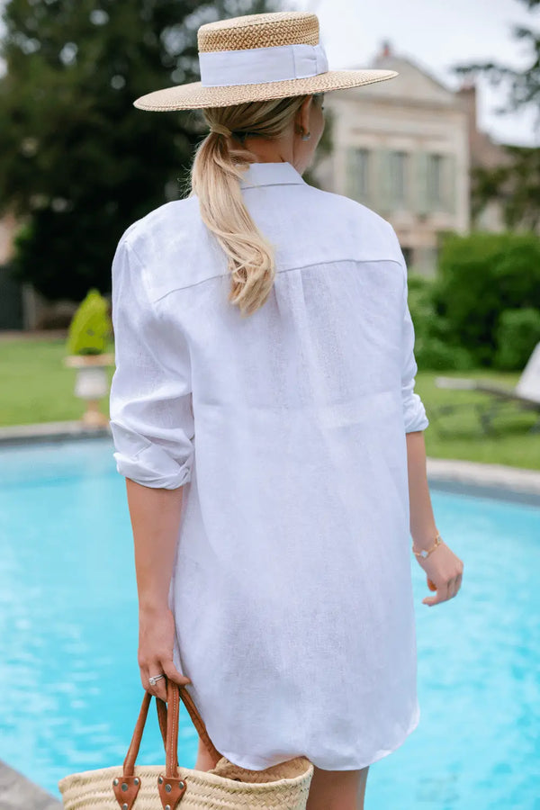 Anna Bey's backside wearing linen shirt beach cover-up in white